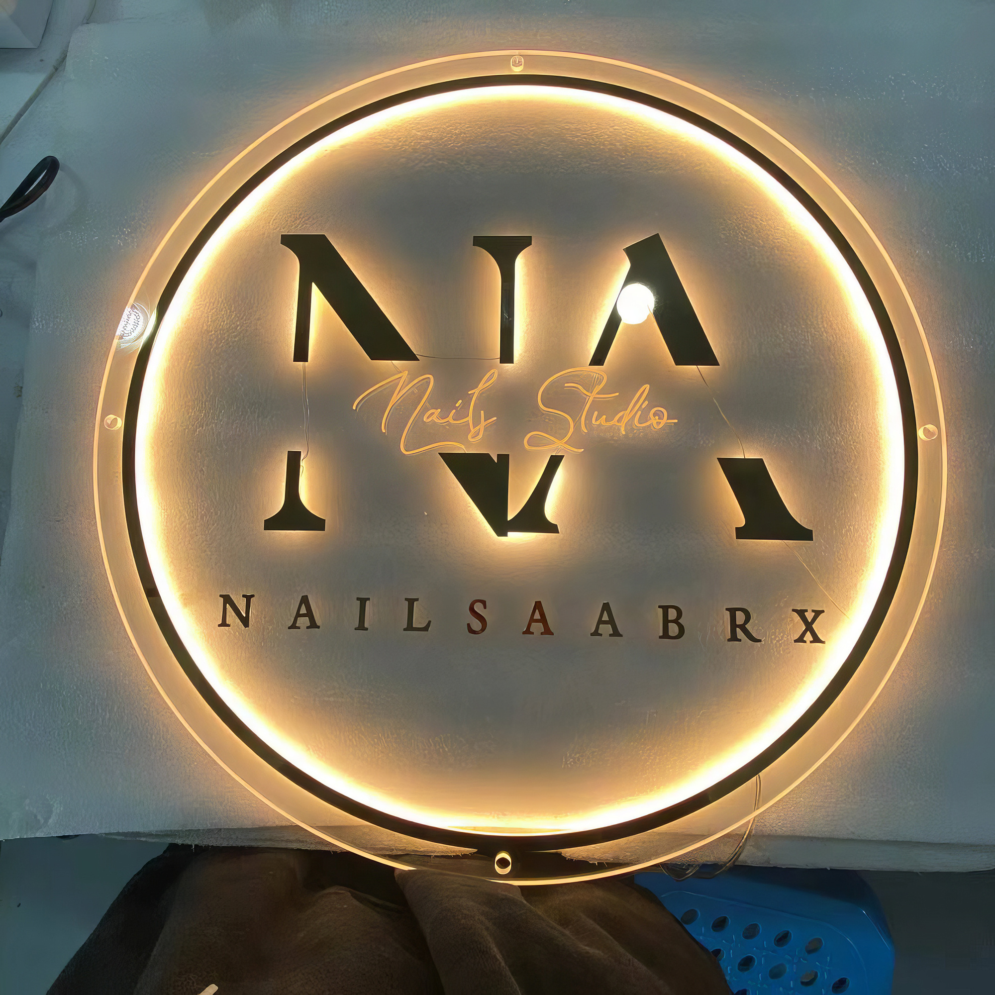 Acrylic logo with LED light. Golden mirror letters, business signs for beauty salon, boutique, barber shop