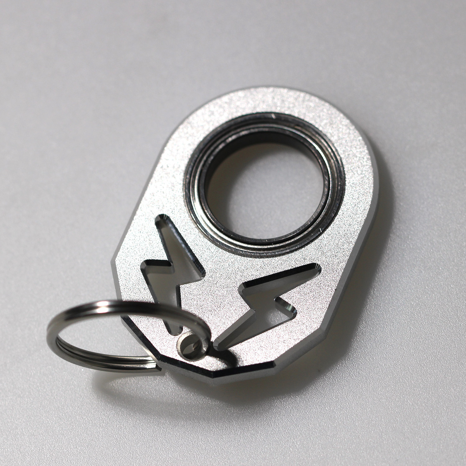 Super cool fidget smooth keychain spinner with lightning logo matches your key anxiety relief keychains anxiety relief keychains