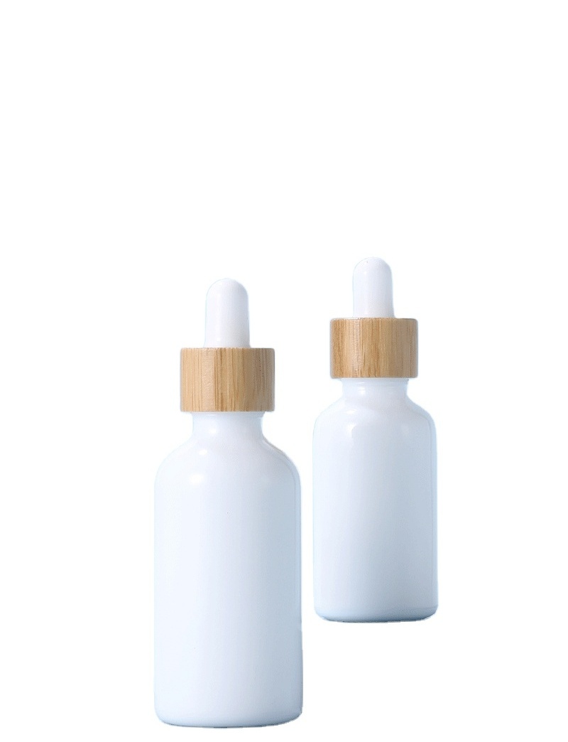 Wholesale White Porcelain 30ml Essential Oil Packaging Serum Glass Dropper Cosmetic Ceramic Bottle With Bamboo Cap