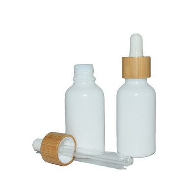 Wholesale White Porcelain 30ml Essential Oil Packaging Serum Glass Dropper Cosmetic Ceramic Bottle With Bamboo Cap