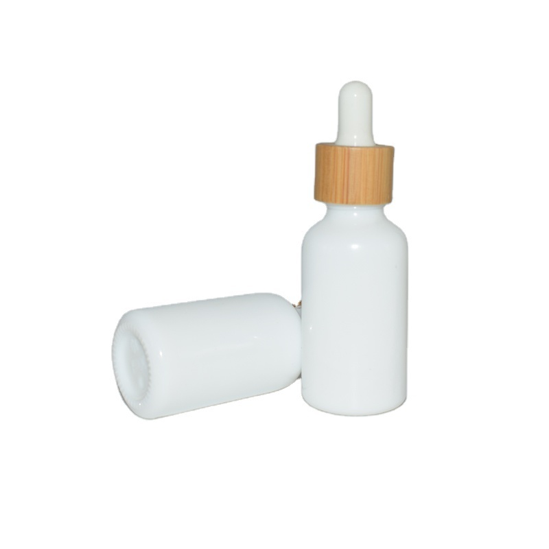 Wholesale White Porcelain 30ml Essential Oil Packaging Serum Glass Dropper Cosmetic Ceramic Bottle With Bamboo Cap