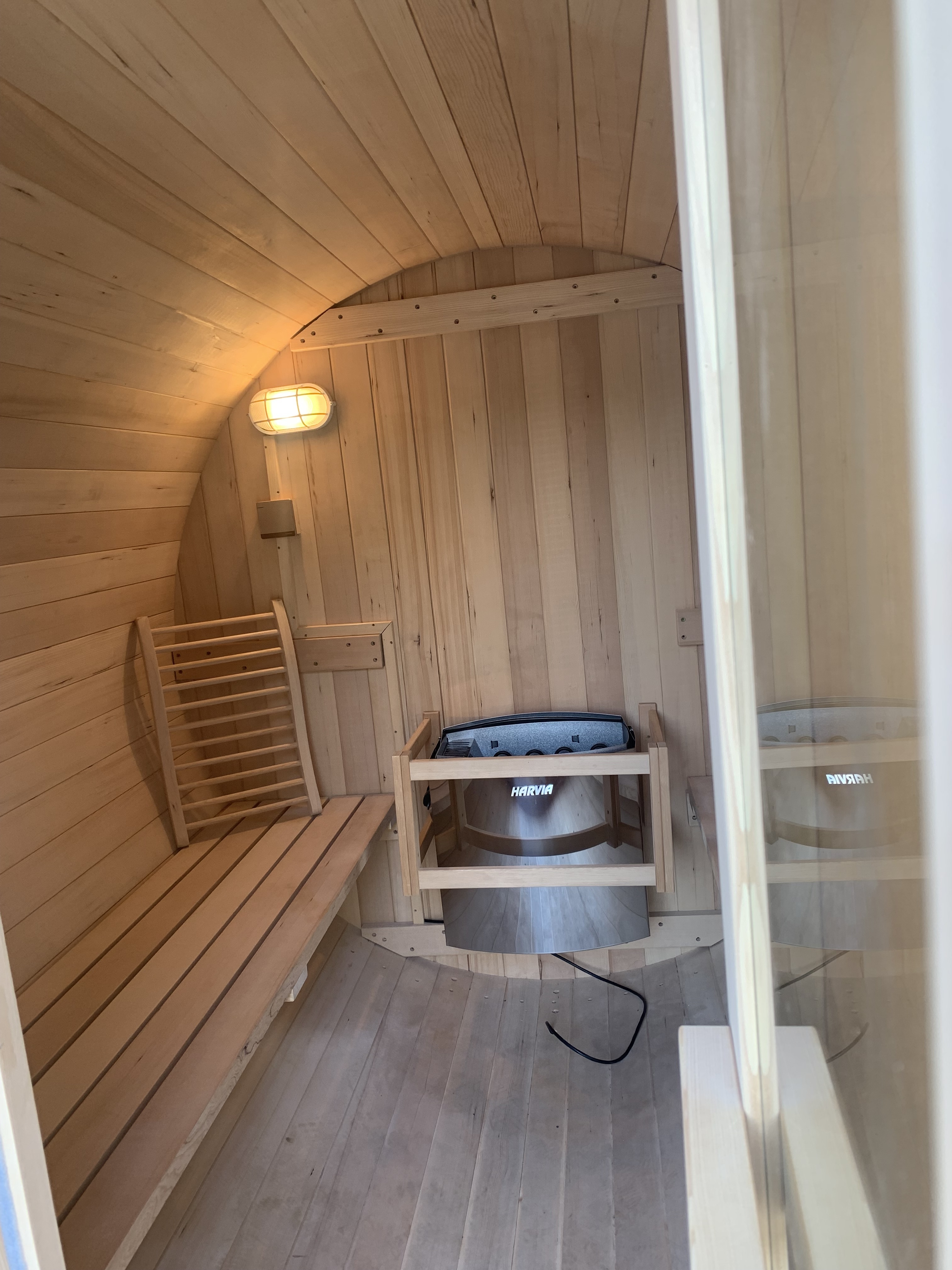 Wet wood cedar barrel sauna with stove