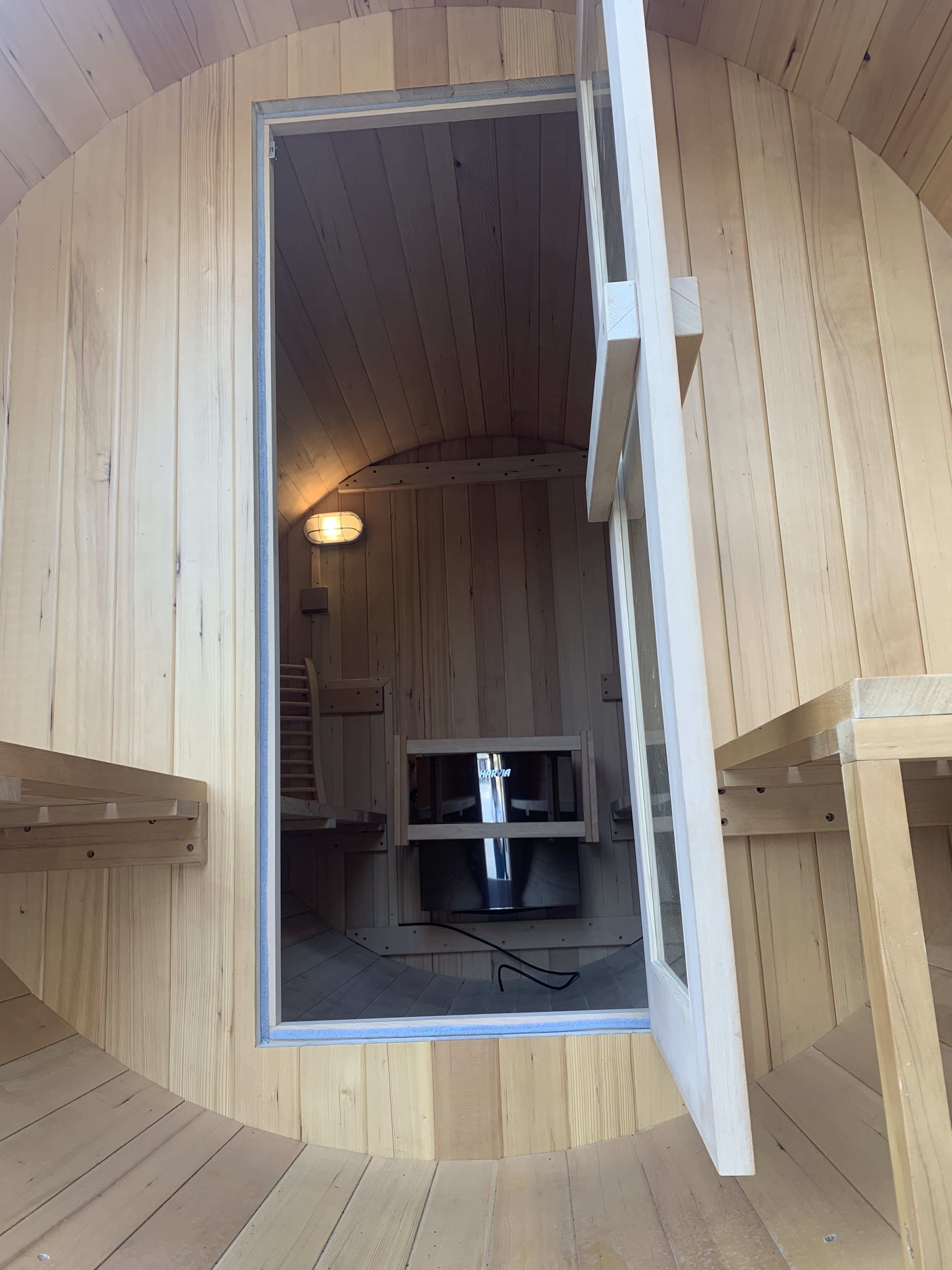 Wet wood cedar barrel sauna with stove