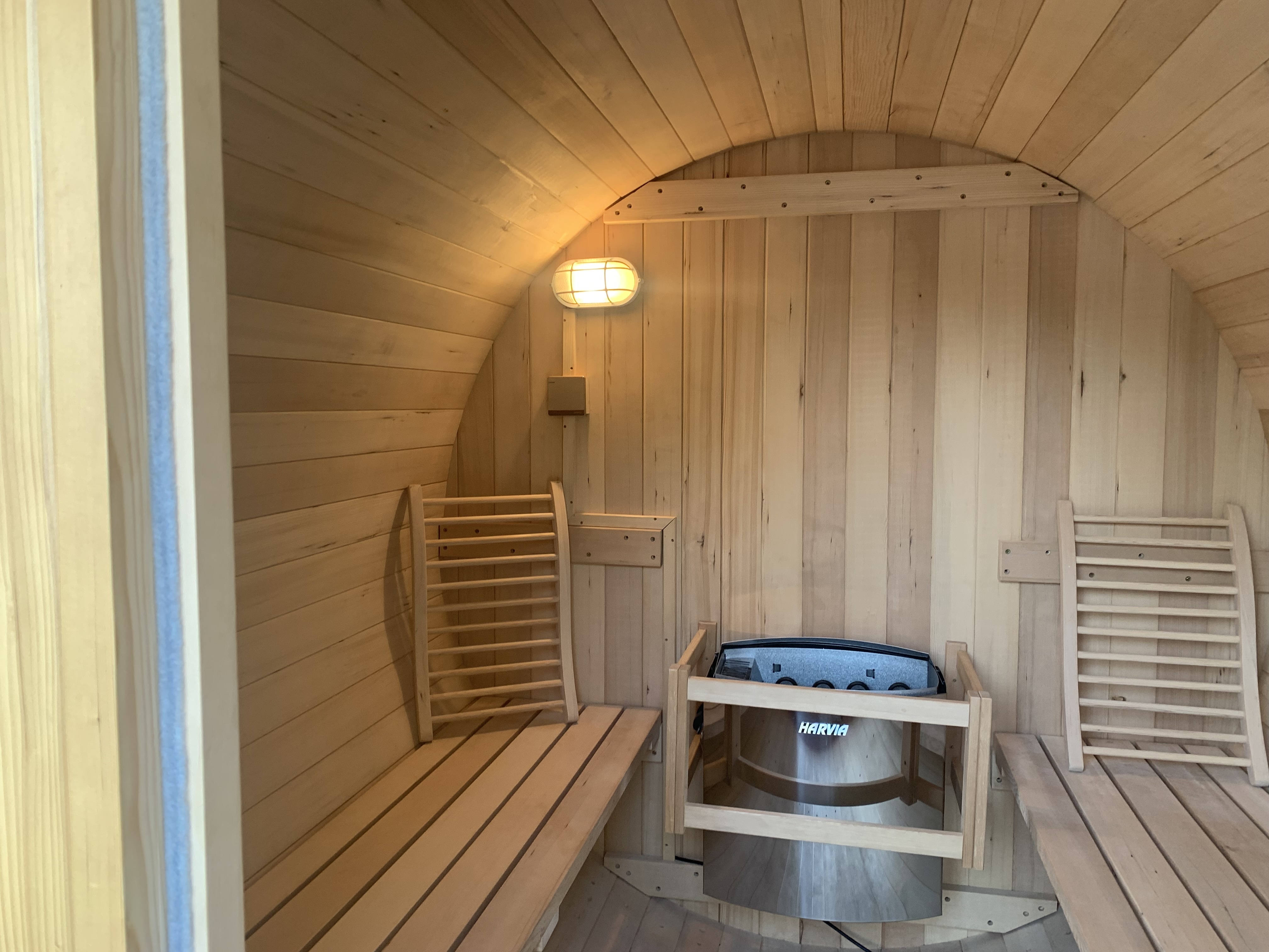 Wet wood cedar barrel sauna with stove