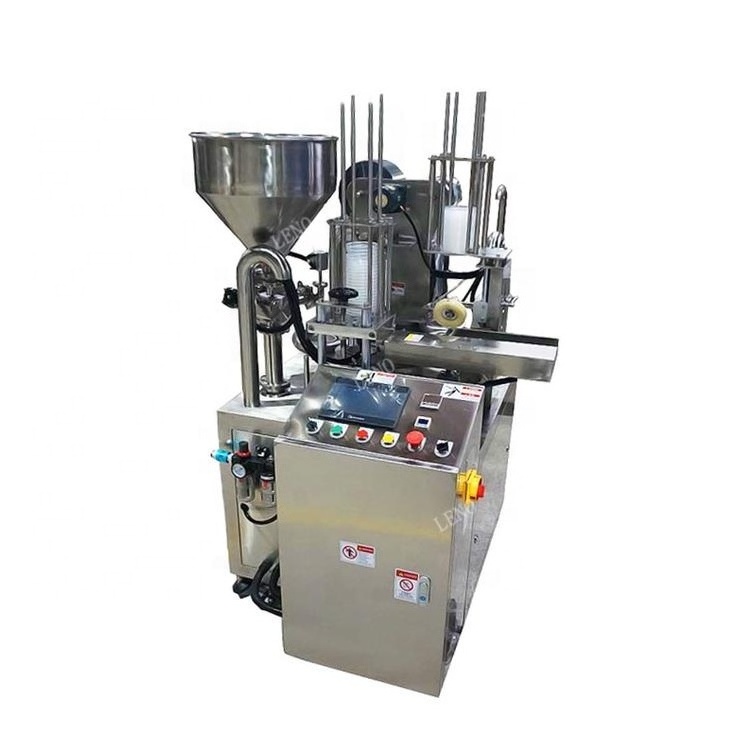 Automatic rotary plastic yogurt mineral water K cup filling sealing packing machine with plexi glass dust cover