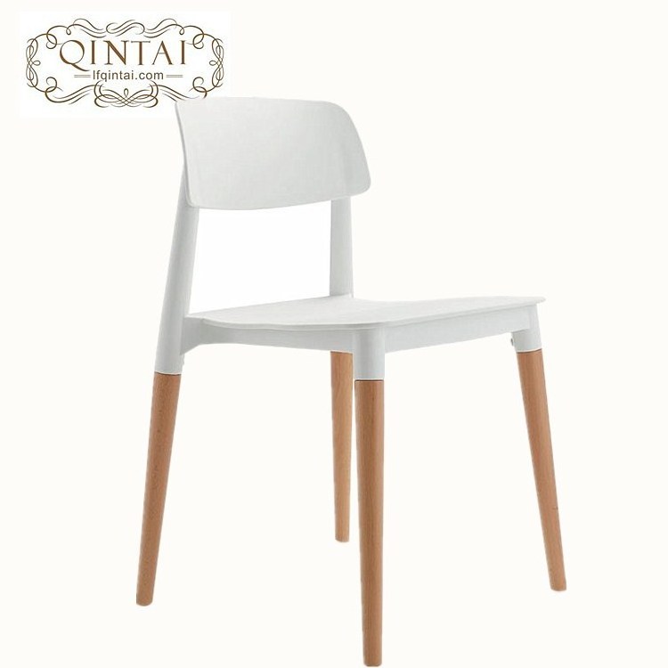 Colorful plastic seat with wooden legs chair