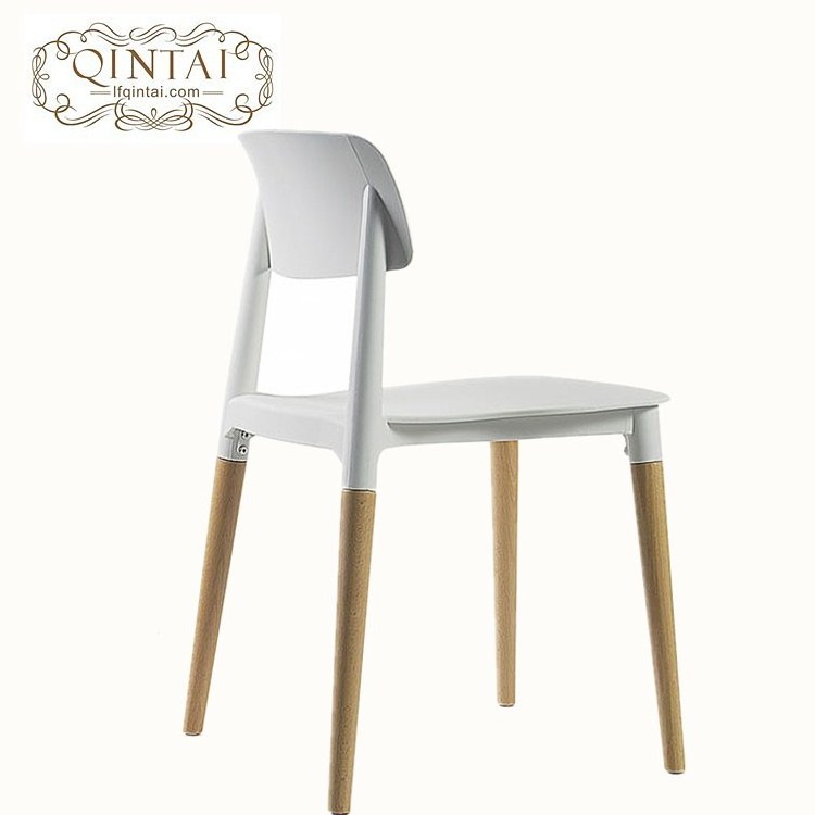 Colorful plastic seat with wooden legs chair