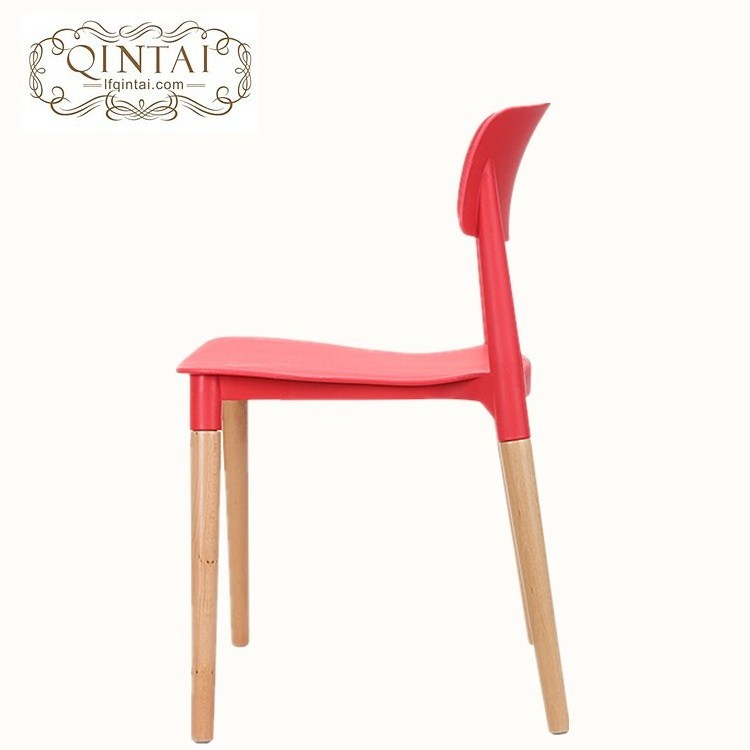 Colorful plastic seat with wooden legs chair