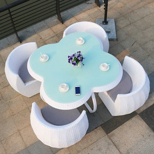 Waterproof backyard garden table and chairs sets 4 seaters rattan flower shape saving space outdoor furniture