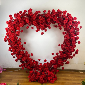 Wedding background online celebrity punch background simulation Budeson heart-shaped arch red artificial rose.