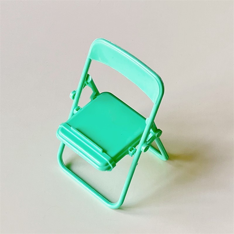 A new creative chair with a small stool style lazy phone holder that can be used as a desktop decoration