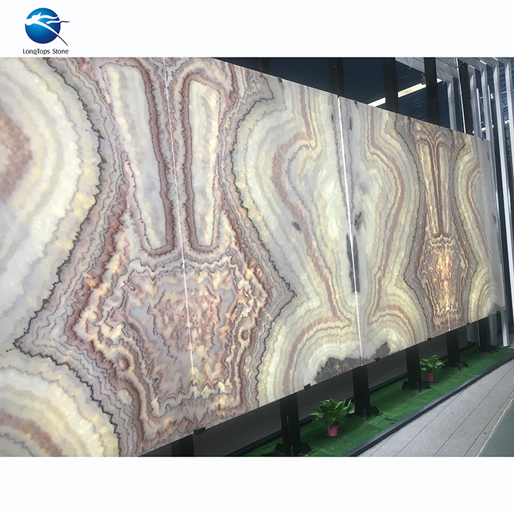 Xiamen Longtops exotic bookmatched backlit red marble onyx slab