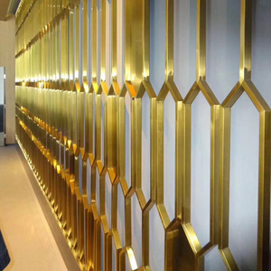 Metal screens with brass color used as the decorative background wall