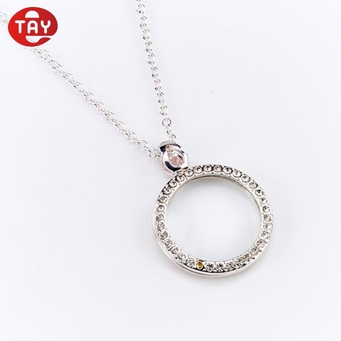 Optical instruments magnifying glass magnifier on a jewelry necklace