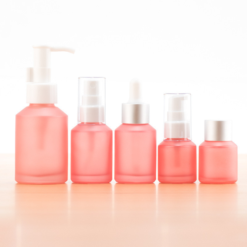 Cosmetics pink frosted glass bottle traveling empty bottle 15ml-100ml spray/pump/screw cap bottle set