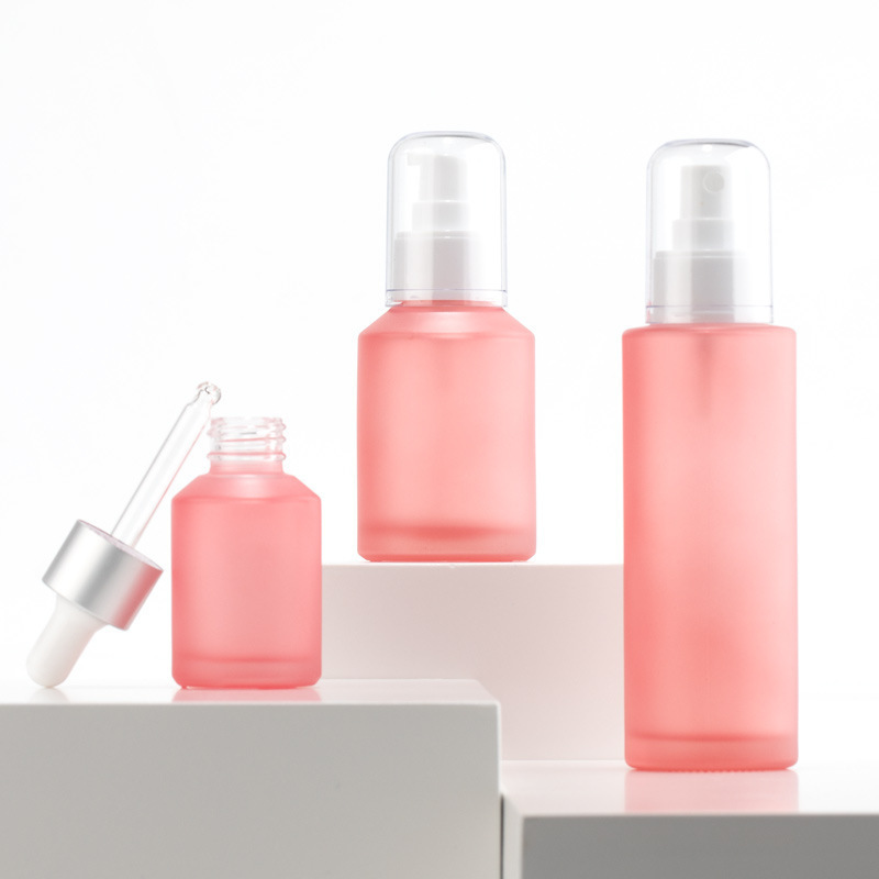 Cosmetics pink frosted glass bottle traveling empty bottle 15ml-100ml spray/pump/screw cap bottle set