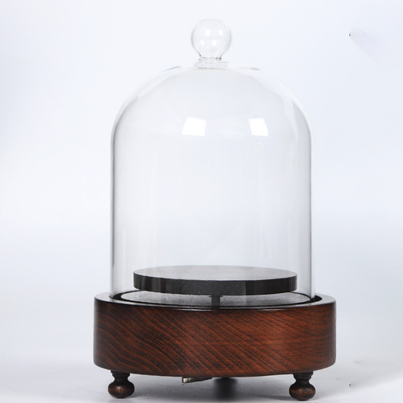 musical glass dome for display