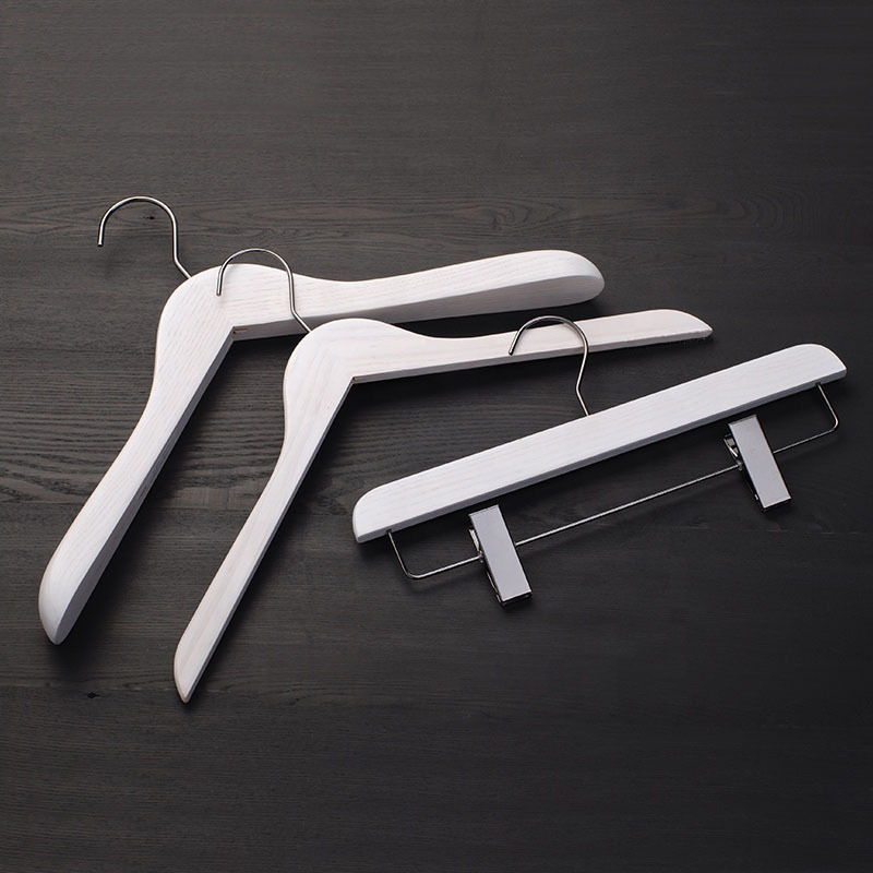 White color wooden hanger for clothes and pants