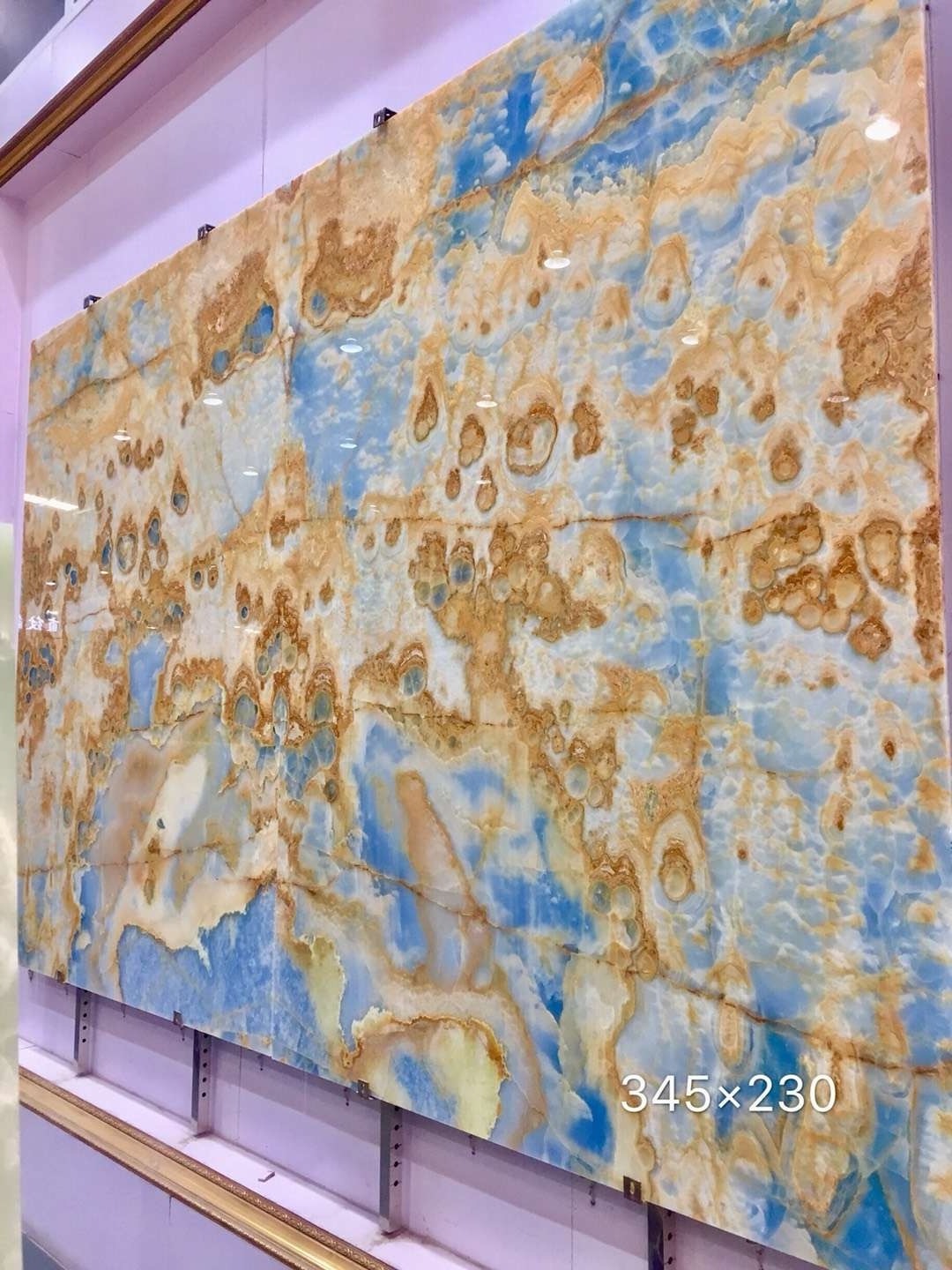 Backlit golden sky blue onyx marble slab wall cladding