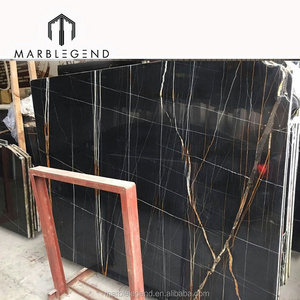 white and gold veins design saint laurent black marble tile