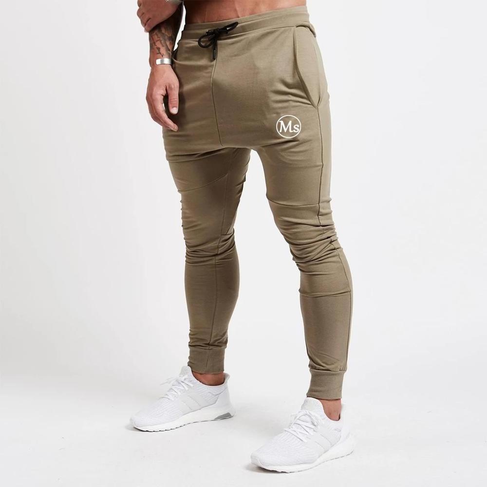 Custom logo slim fit stretchy pure colour printing men's joggers wholesale