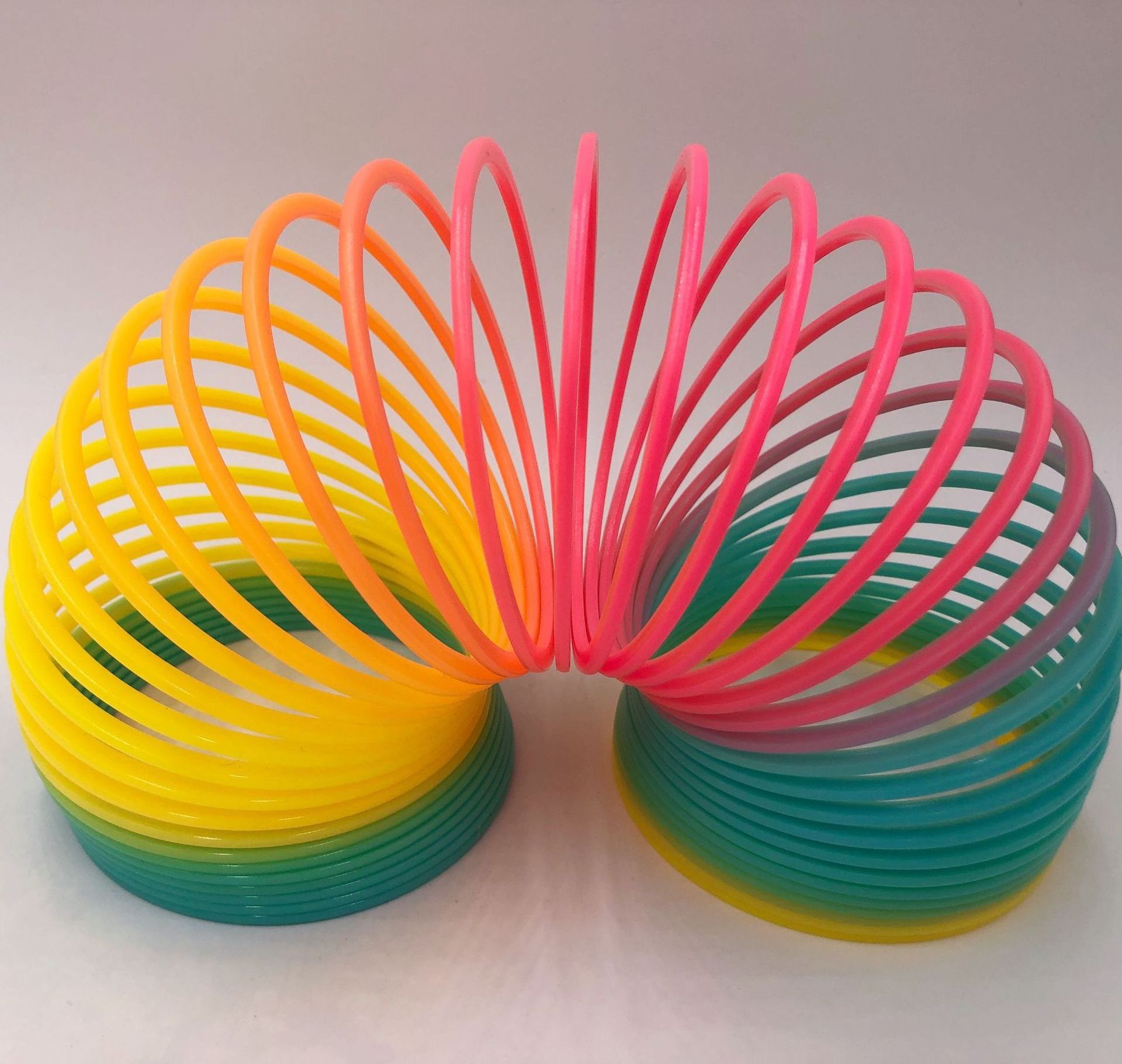 Hot Sale Child Colorful Rainbow Circle Folding Plastic Spring Coil Toy For Children Magic Educational Toys