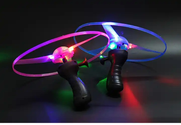 Hot Sale  led Plastic Hand Push Rotating Flying Saucer Toy Children's toy colorful glowing saucer flying