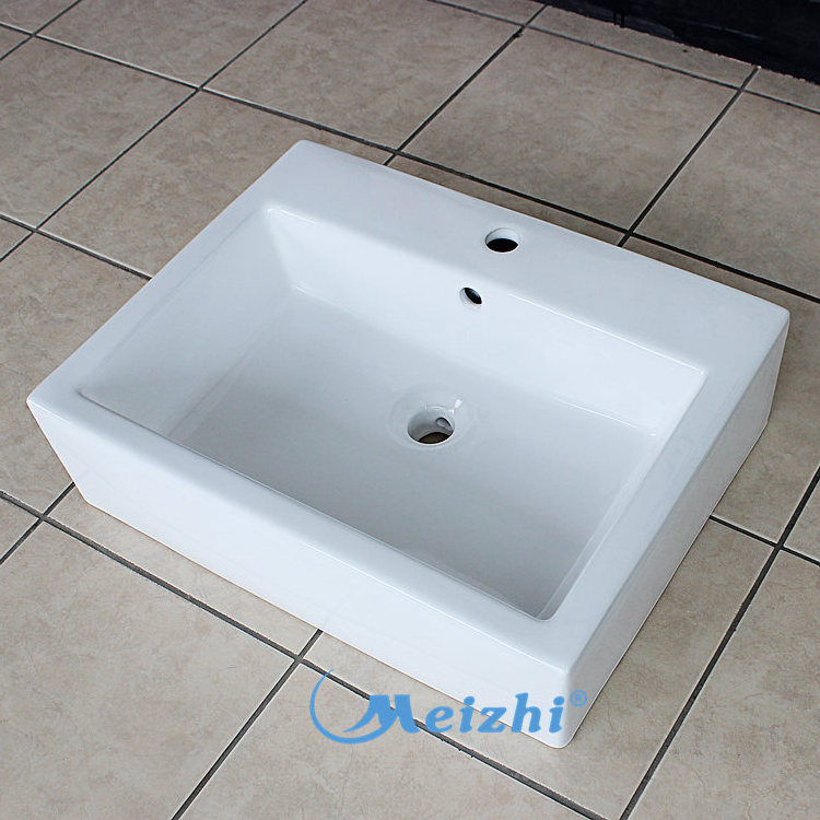 Ceramic sanitary ware above counter vessel sinks