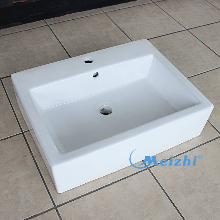 Ceramic sanitary ware above counter vessel sinks