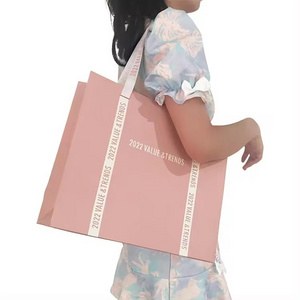 New pink packaging shopping bag with ribbon , 250gsm custom CMYK printing paper tote bag for gift