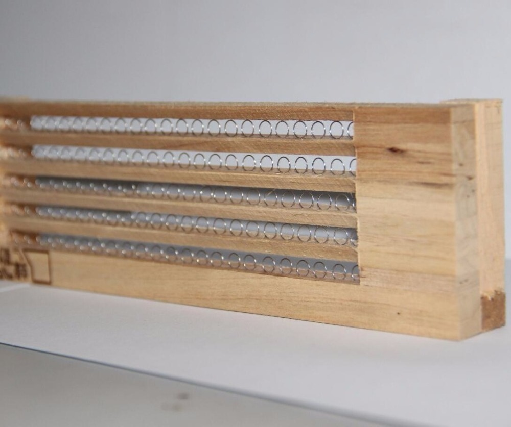 beekeeping rows wooden pollen collector trap