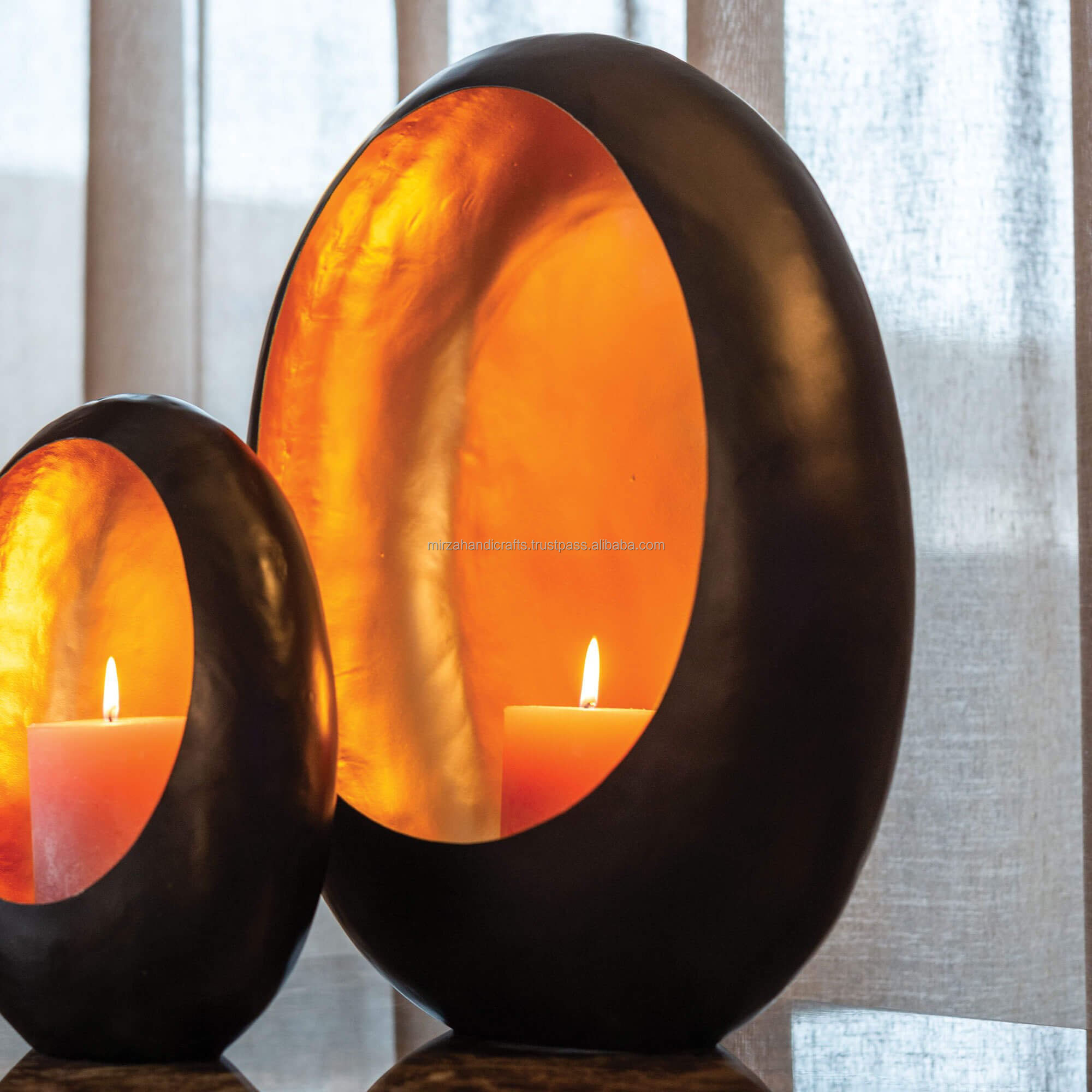 Metal Decorative candle holder black with gold large is a chic black candle holder with gold interior in egg shape