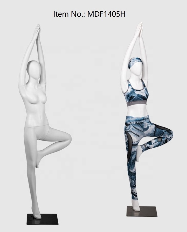 .window display female yoga mannequin