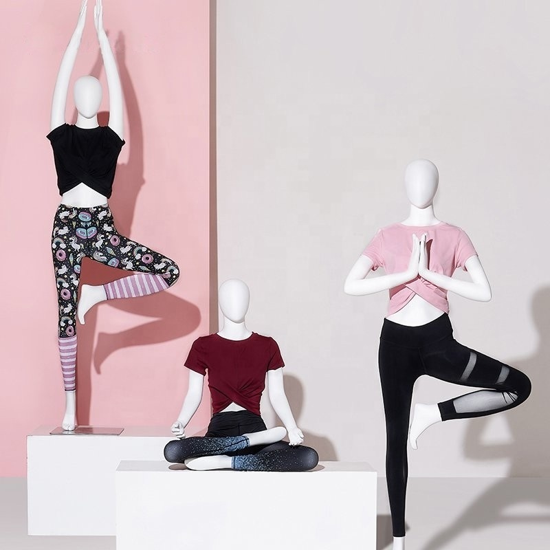 .window display female yoga mannequin