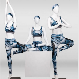 .window display female yoga mannequin