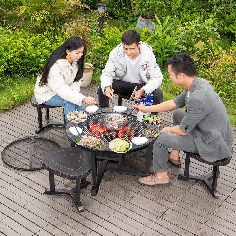 Garden die cast iron bbq table dia 100cm height 58cm with center fire pits and four chairs