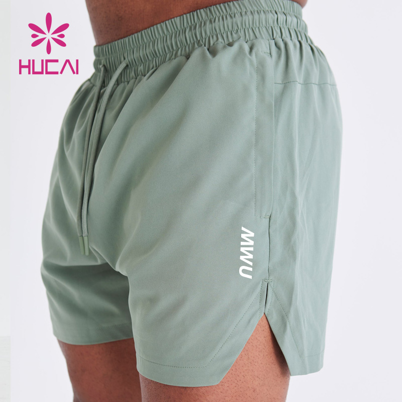 HUCAI custom logo polyester spandex  Athletic nylon short split Hem cut workout mens gym sports shorts