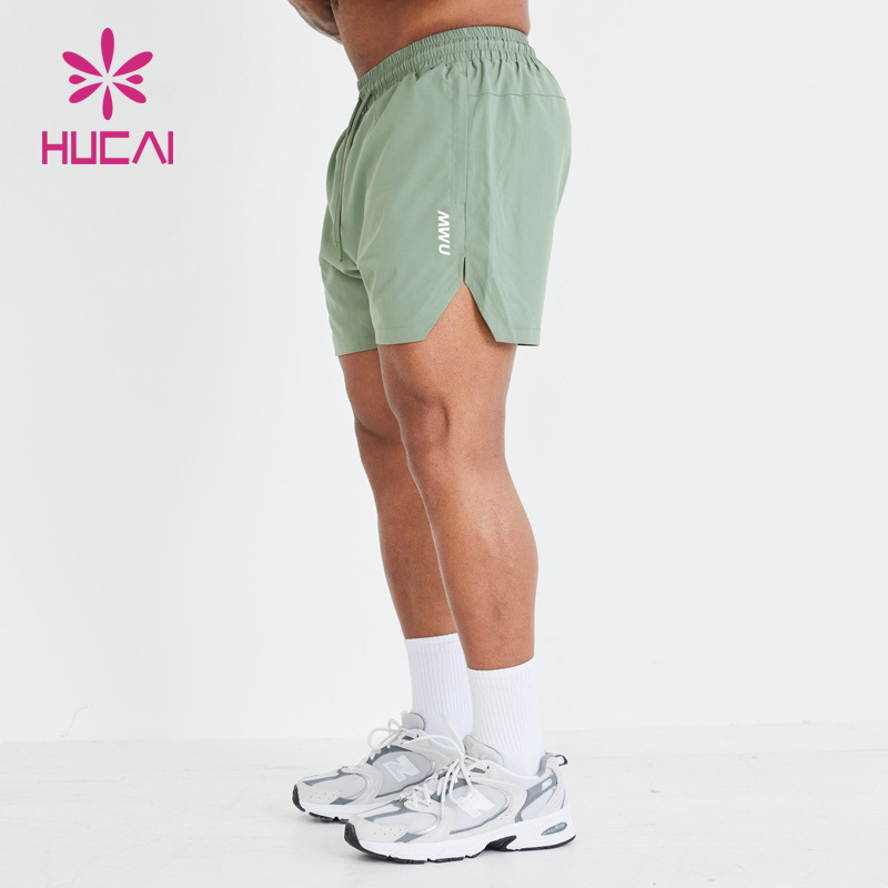 HUCAI custom logo polyester spandex  Athletic nylon short split Hem cut workout mens gym sports shorts