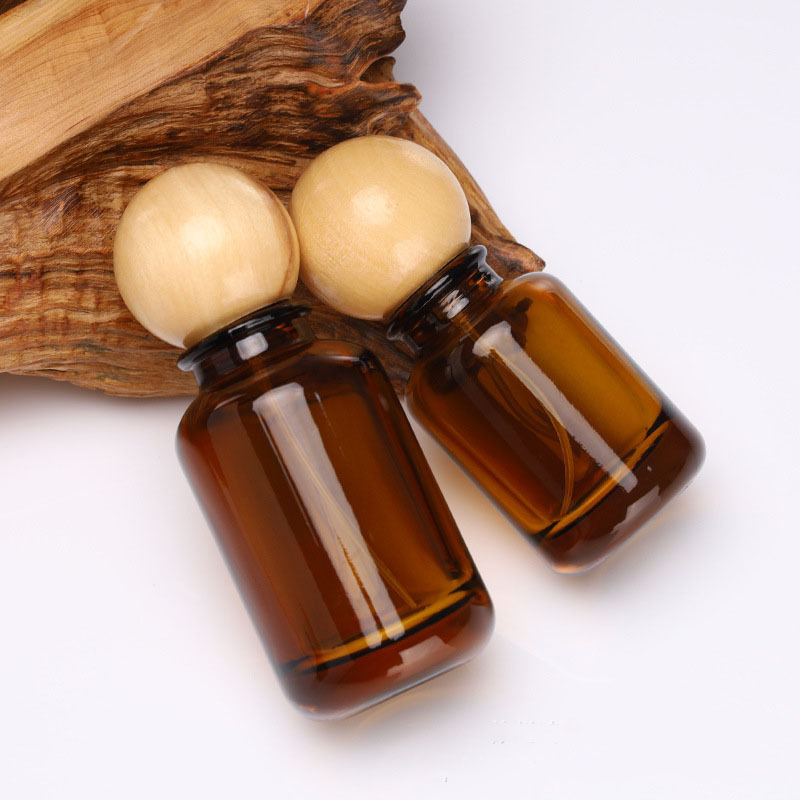 MUB Custom Logo 30ml 50ml 100ml Amber Color Crimp Neck Round Perfume Spray Bottle With Wood Ball Cap