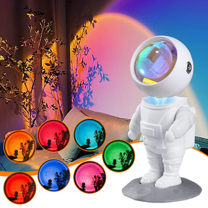 KSWING Astronaut Sunset Projector Night Light 7 Colors Mode & Built-in Battery Lights 360 Rotating Head Cosmonaut Lamp