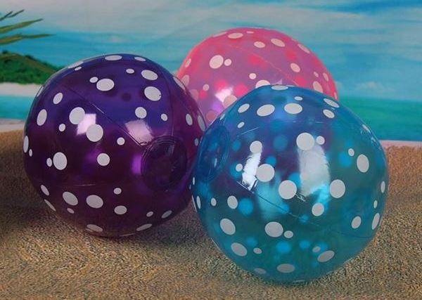 Inflatable transparent beach ball with toy fish inside