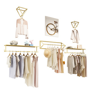 Custom Boutique Hanging Clothes Shelves Wall Mounted Stainless Steel Gold Wall Clothing Rack for Clothing Store