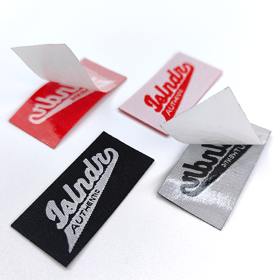 Wholesale Embossed LOGO Fabric Care Labels for Clothing Melt Glue Adhesive Heat Press Sticker Cotton Polyester Tag