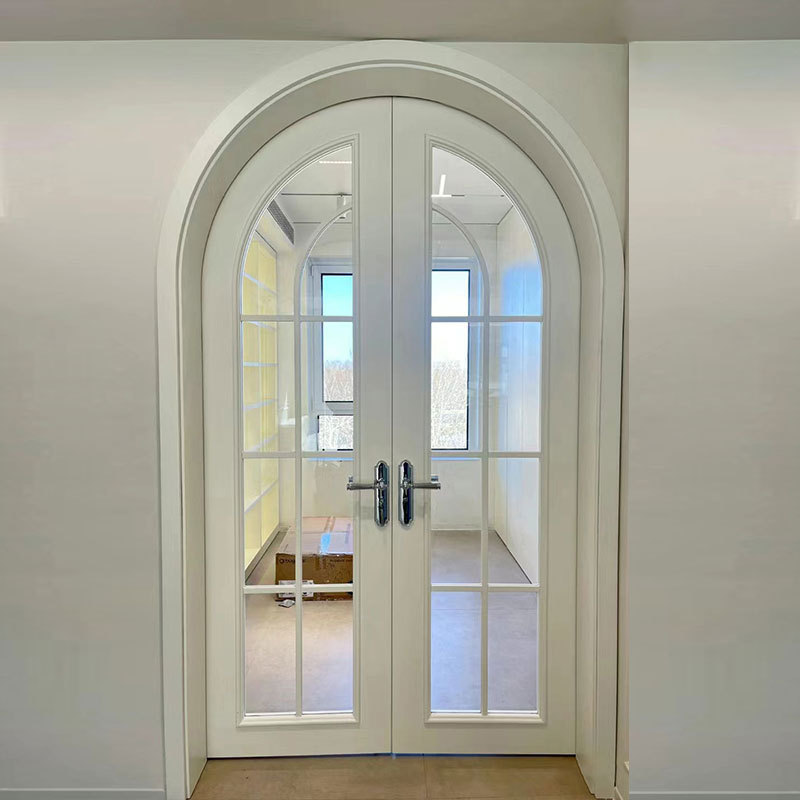 French style double arched door with glass the material is solid wood or solid wood multi-layer waterproof door very hard