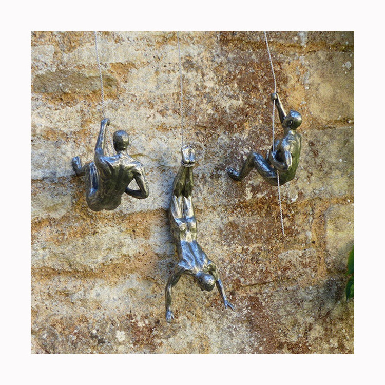 High quality hand carved home wall decoration metal bronze man climbing wall art sculpture