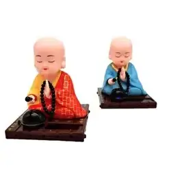 Shaking head car decoration small monk Buddha statue creative doll home solar small monk car decoration blue red yellow