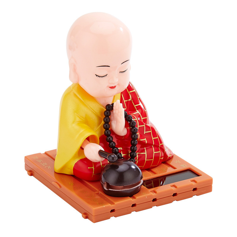 Shaking head car decoration small monk Buddha statue creative doll home solar small monk car decoration blue red yellow