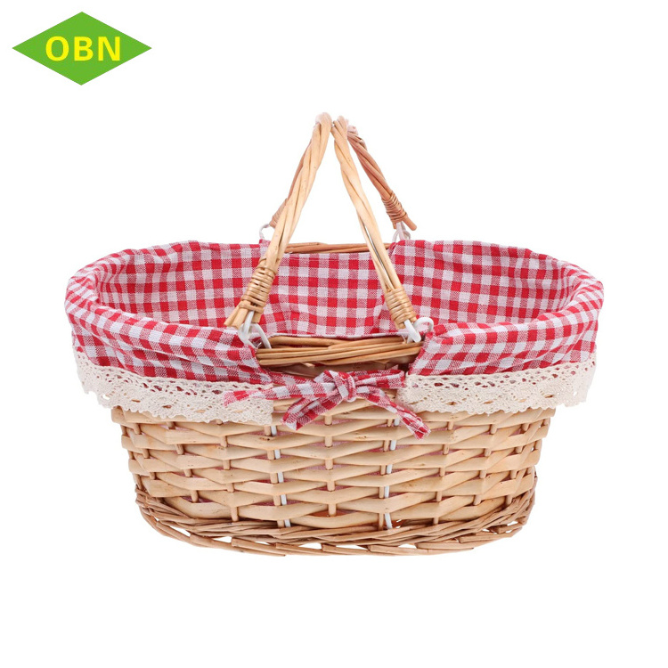 Large decorative natural empty oval wicker picnic basket with handle