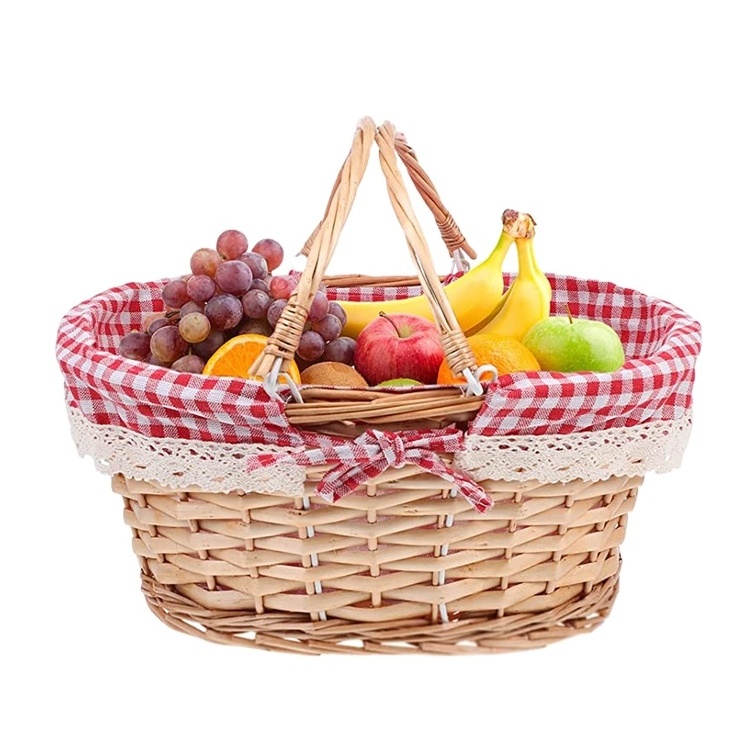 Large decorative natural empty oval wicker picnic basket with handle