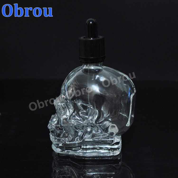 Wholesale 30ml perfume bottle essential oil glass skull bottle with child proof dropper